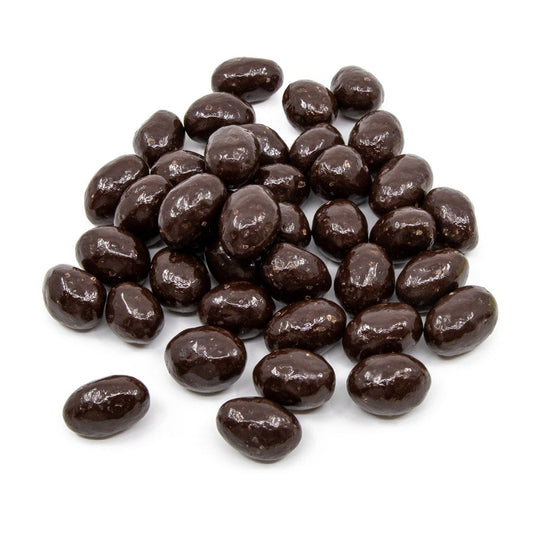 La Belge premium pistachios coated in rich Belgian dark chocolate presented in a clear gift jar.